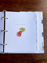 Load image into Gallery viewer, Open binder with labeled tabs on a wooden surface