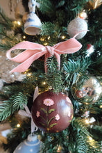 Load image into Gallery viewer, Hand painted Christmas ornament with pink flowers on a deep burgundy background