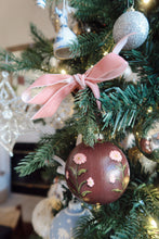 Load image into Gallery viewer, Decorative Christmas ornament with floral patterns on a tree