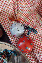 Load image into Gallery viewer, Two hand painted Christmas ornaments on a red check background