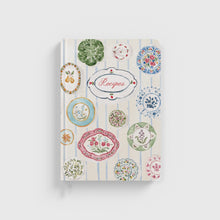 Load image into Gallery viewer, A hardcover recipe journal with a decorative plate pattern on the cover and the word 'Recipes' displayed prominently in the center.