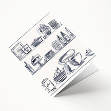 Load image into Gallery viewer, A blue and white file folder with a whimsical kitchen-themed illustration, featuring shelves, bowls, and other kitchen items.
