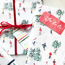 Load image into Gallery viewer, christmas gifts wrapped in skiers watercolor wrapping paper the illustrated life