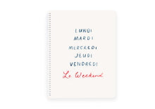 Load image into Gallery viewer, A white spiral notebook with blue and red text, labeled 'Le Weekend' and the days of the week in French.